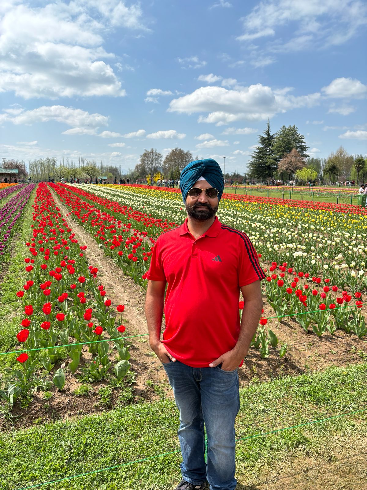Pargat Brar, Naturopath and Ayurveda Diet Consultant, standing outdoors on a sunny day
